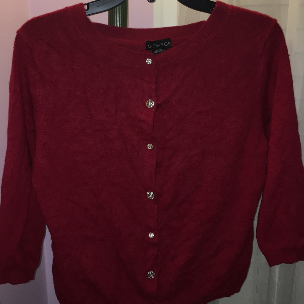 A red sweater with fancy buttons!